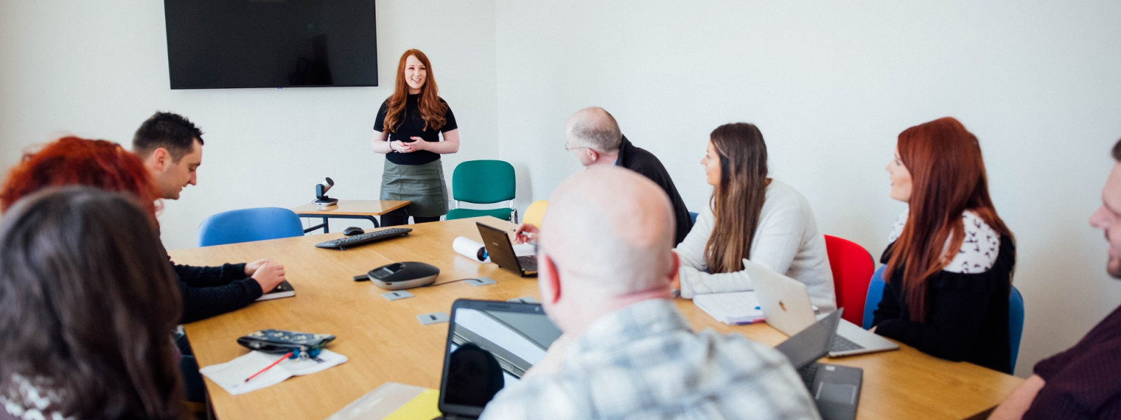 People in a meeting room at MIC