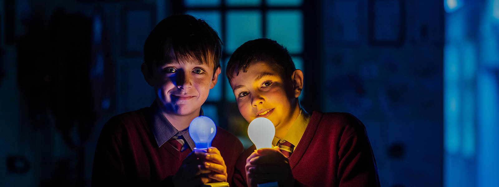 Two boys with lightbulbs.