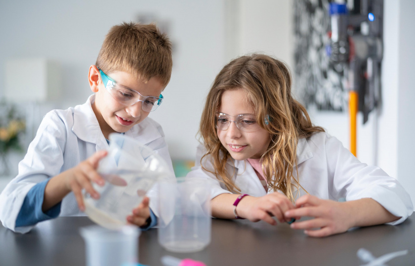 Children using science equipment