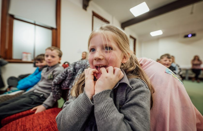 Girl with hands in mouth at CRAFT workshop