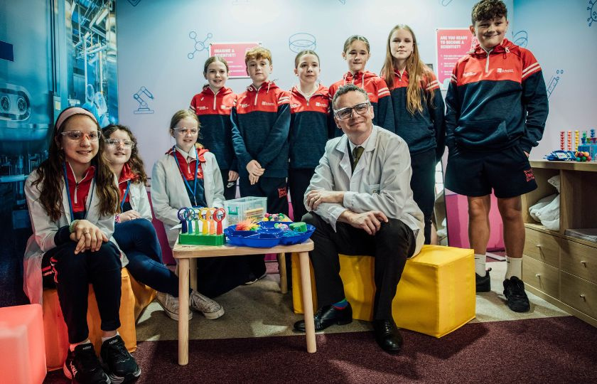 Minister Patrick O'Donovan with children dressed as scienctists