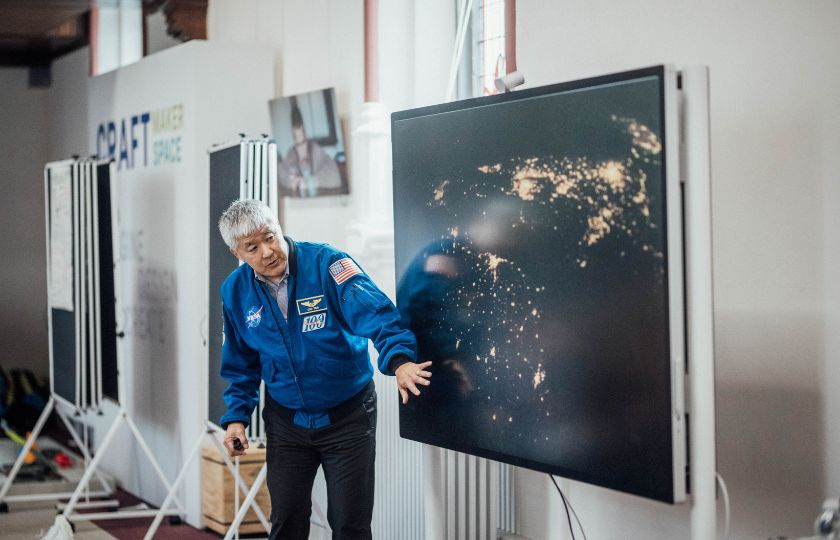 Former NASA astronaut Dan Tani giving a presentation to local school children in CRAFT Maker Space, MIC.